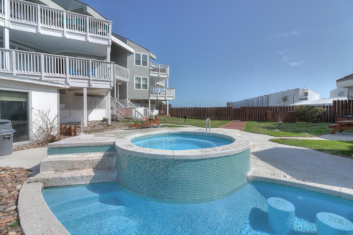 Dive into your private oasis with this stunning pool and spa combo, perfect for cooling off or soaking under the sun.