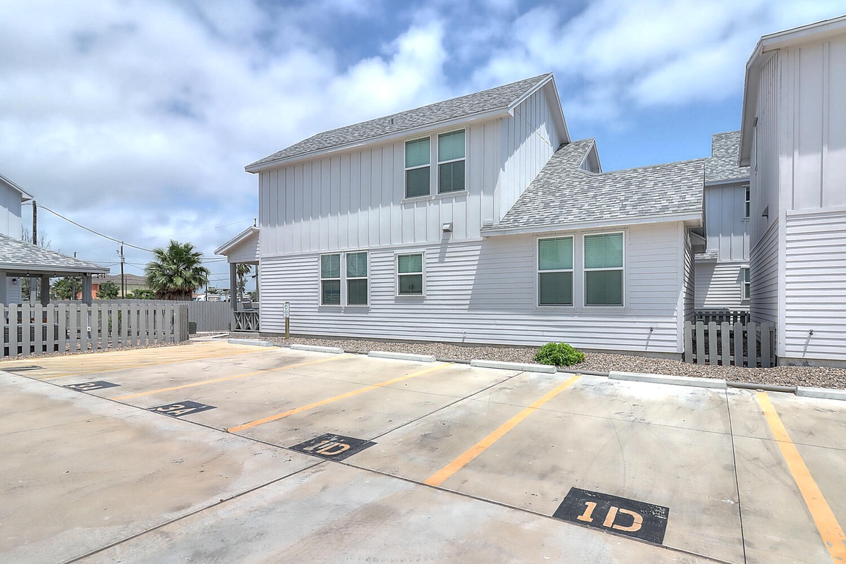 Modern coastal home with dedicated parking spaces right at your doorstep for ultimate convenience.