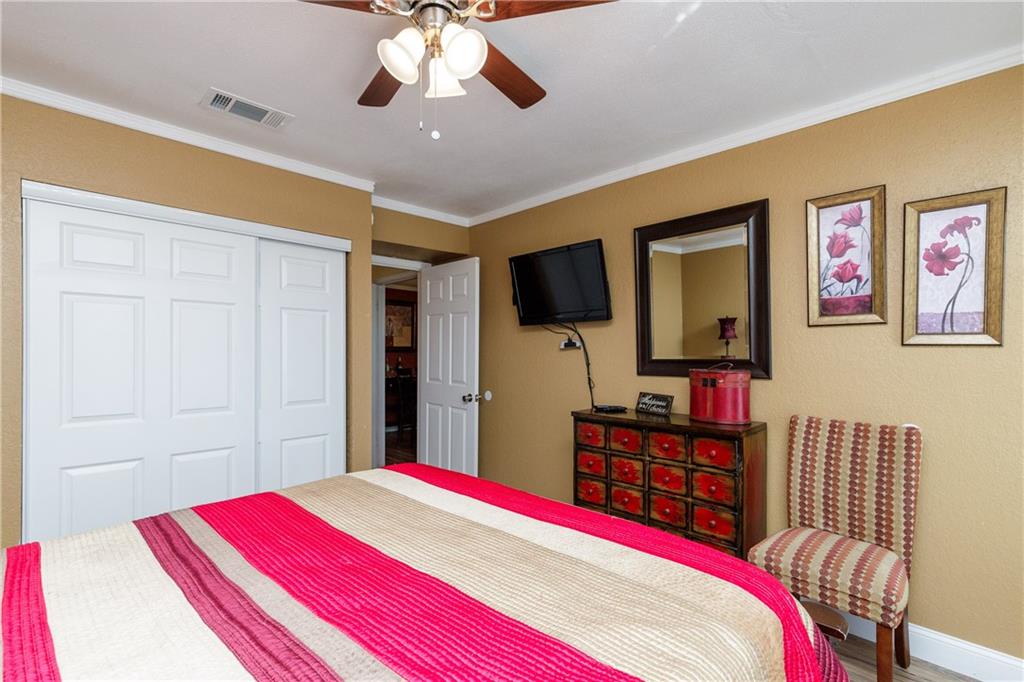 Unwind in your cozy bedroom with entertainment and thoughtful touches designed for comfort and relaxation.
