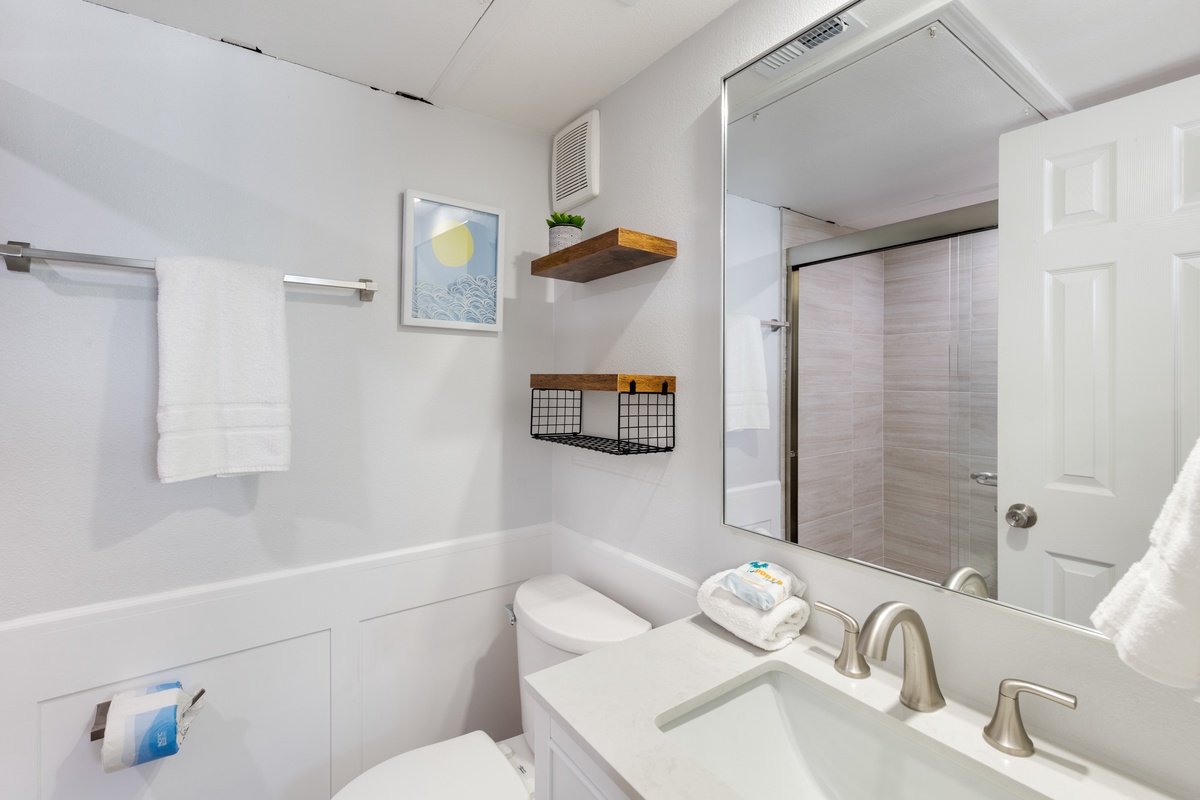 Your pristine bathroom features a luxurious tub and rainfall shower, creating your perfect sanctuary for relaxing after each adventure.