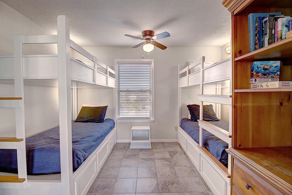 You'll love this fun bunk room with four cozy beds, perfect for kids or groups sharing adventures together.