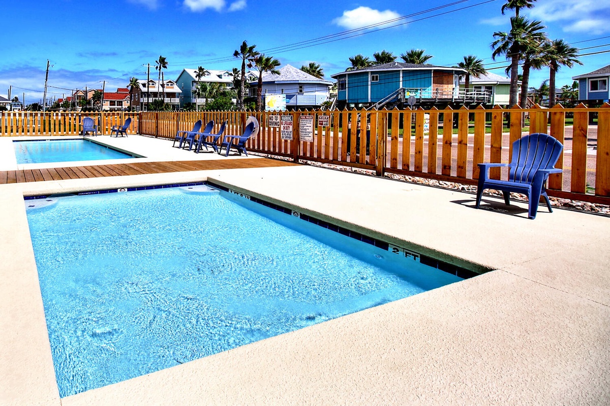 Dive into crystal-clear pools surrounded by tropical palms and colorful beach houses, where your perfect poolside retreat awaits.