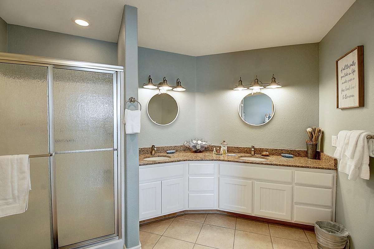 Unwind in your spacious master bathroom with dual vanities, granite countertops, and a walk-in shower—perfect for your morning routine.