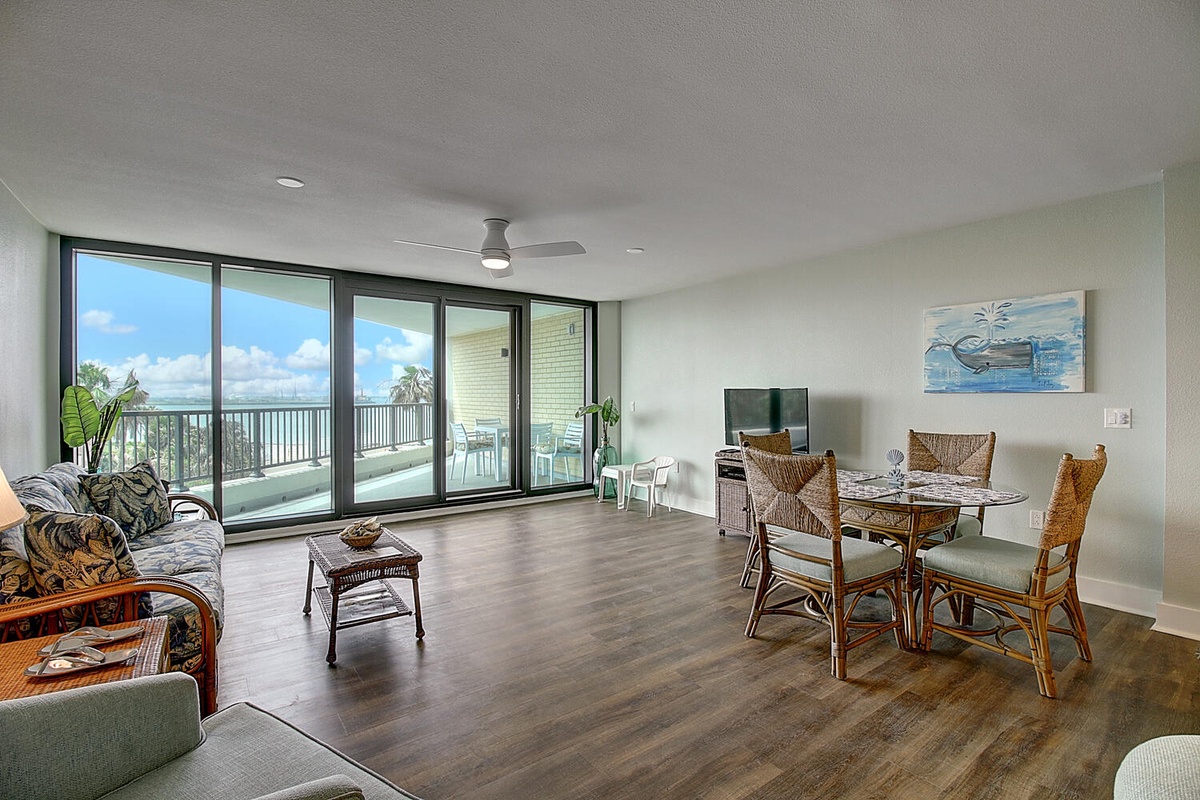 Your spacious living area opens to stunning ocean views through floor-to-ceiling windows, creating the perfect backdrop for relaxing.