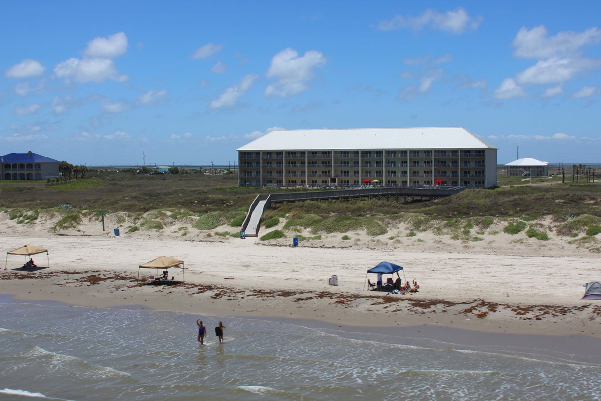 Beachfront property with direct access to pristine sandy shores and gentle Gulf waters.