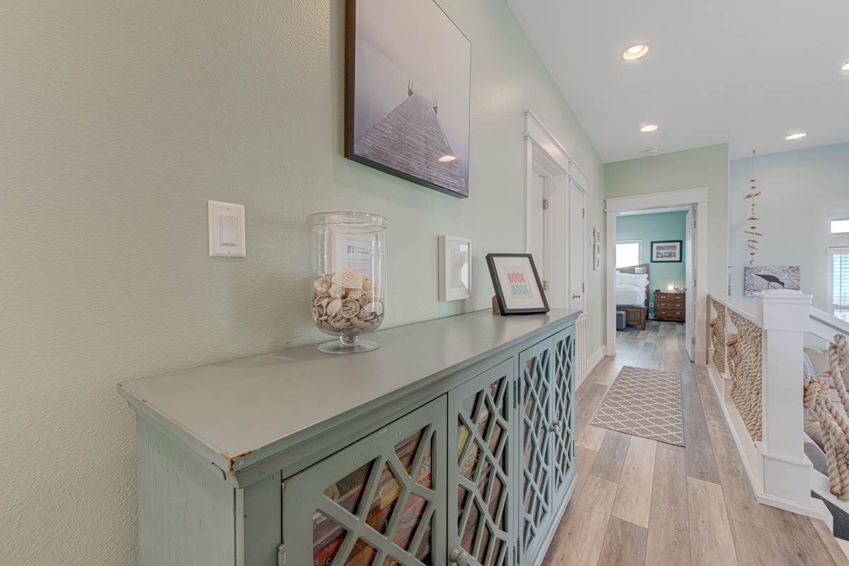 Step into your coastal retreat's welcoming hallway, where sea-glass hues and nautical touches create the perfect seaside sanctuary for your getaway.