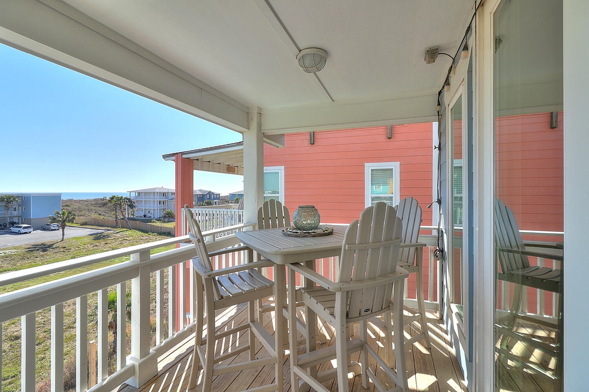 Sip your morning coffee on your private balcony while watching the sunrise over distant waters, surrounded by colorful coastal charm.