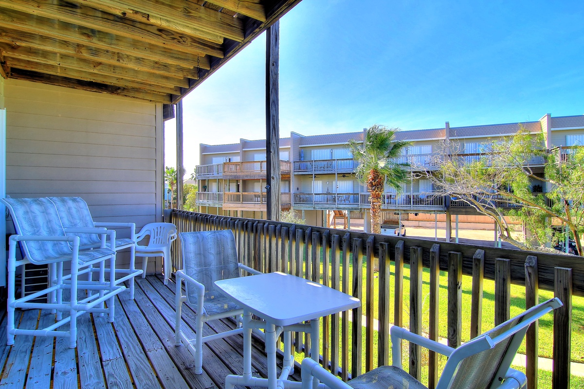 Step onto your private deck and unwind on comfortable seating while enjoying views of the peaceful grounds and sunny skies.