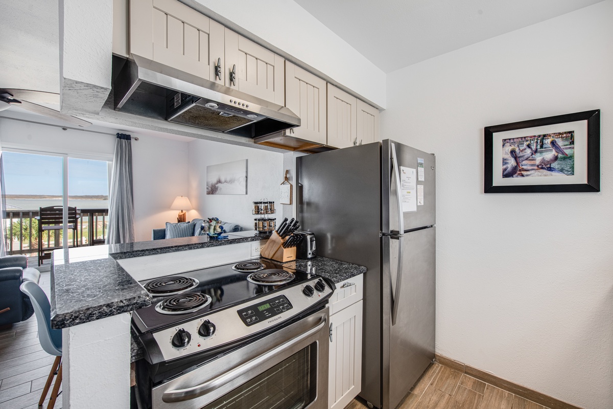Your fully equipped kitchen awaits with granite counters, stainless appliances, and everything you need to create memorable meals.
