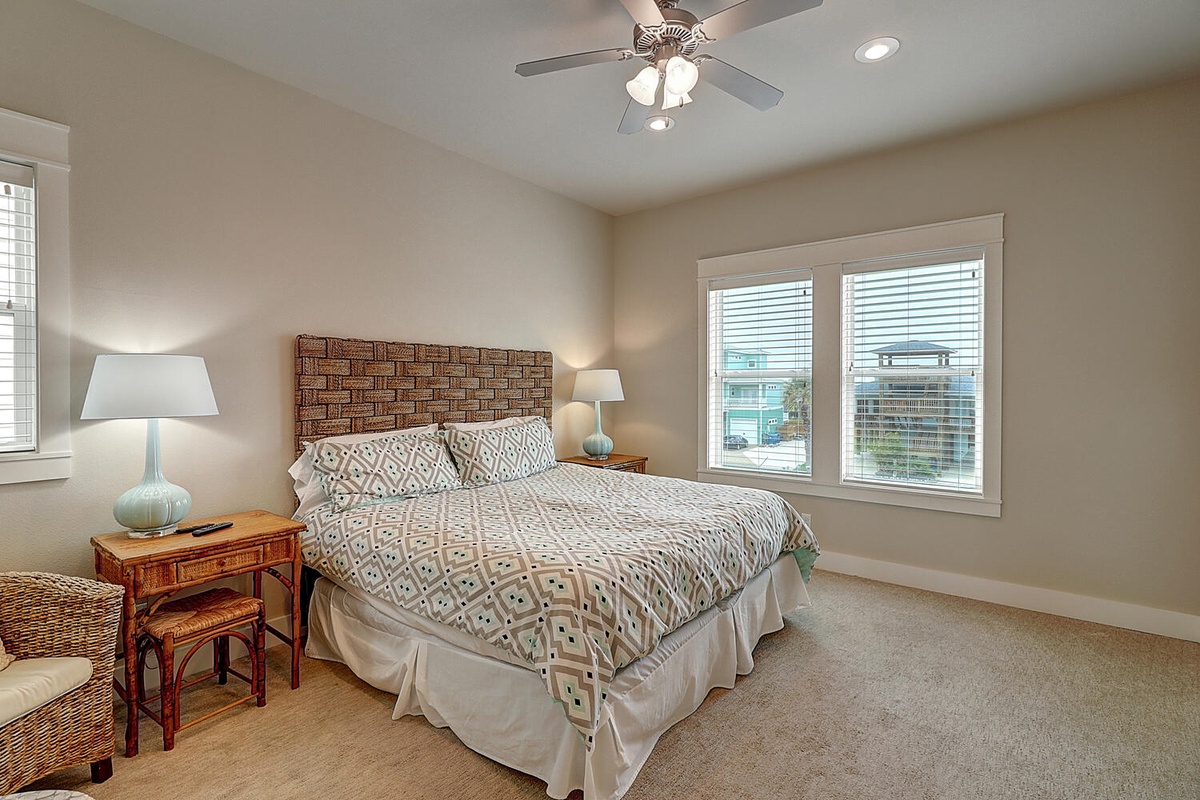 Sleep peacefully in your cozy bedroom featuring a plush queen bed, calming decor, and natural light streaming through large windows.