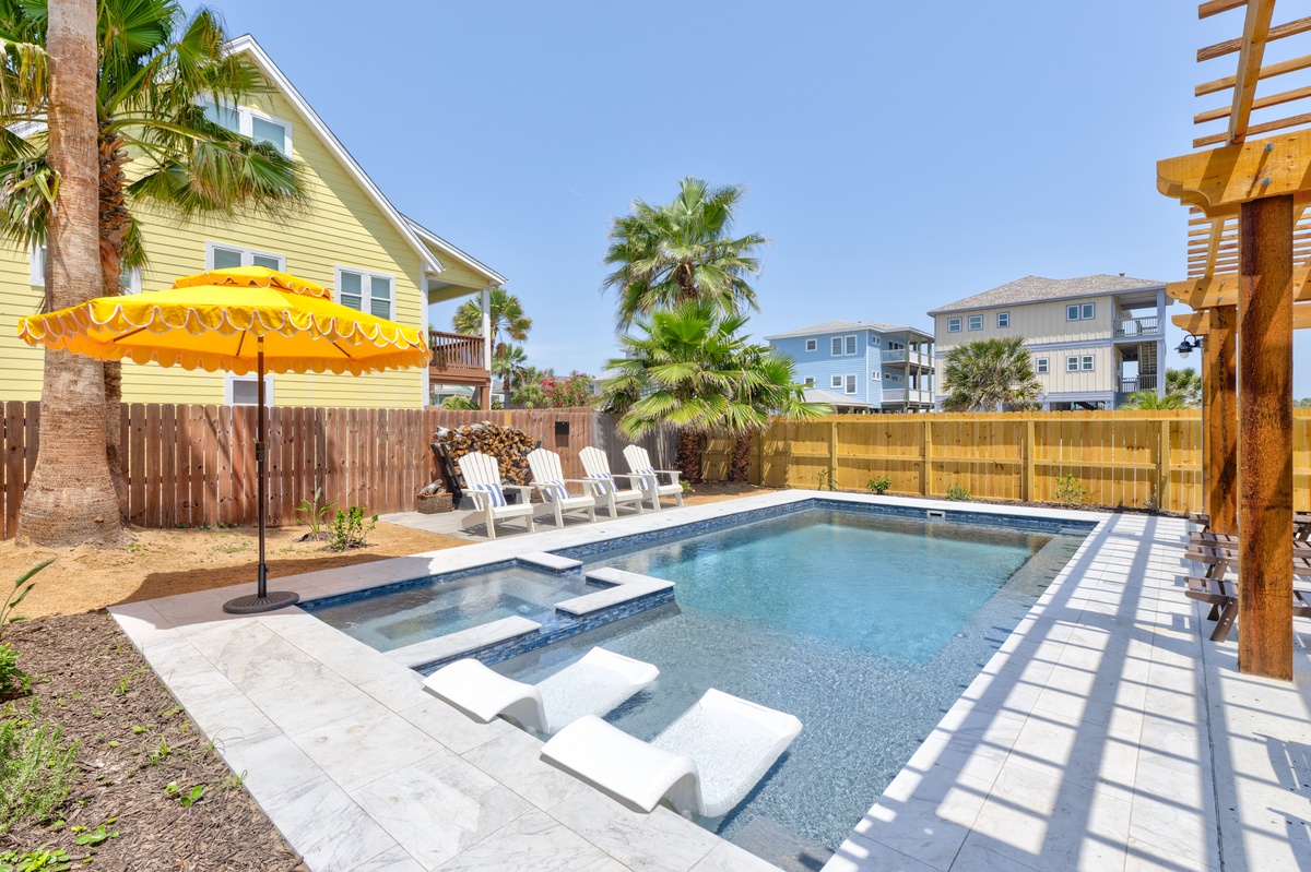 Dive into your private pool oasis with spa, surrounded by tropical palms and sunshine.
