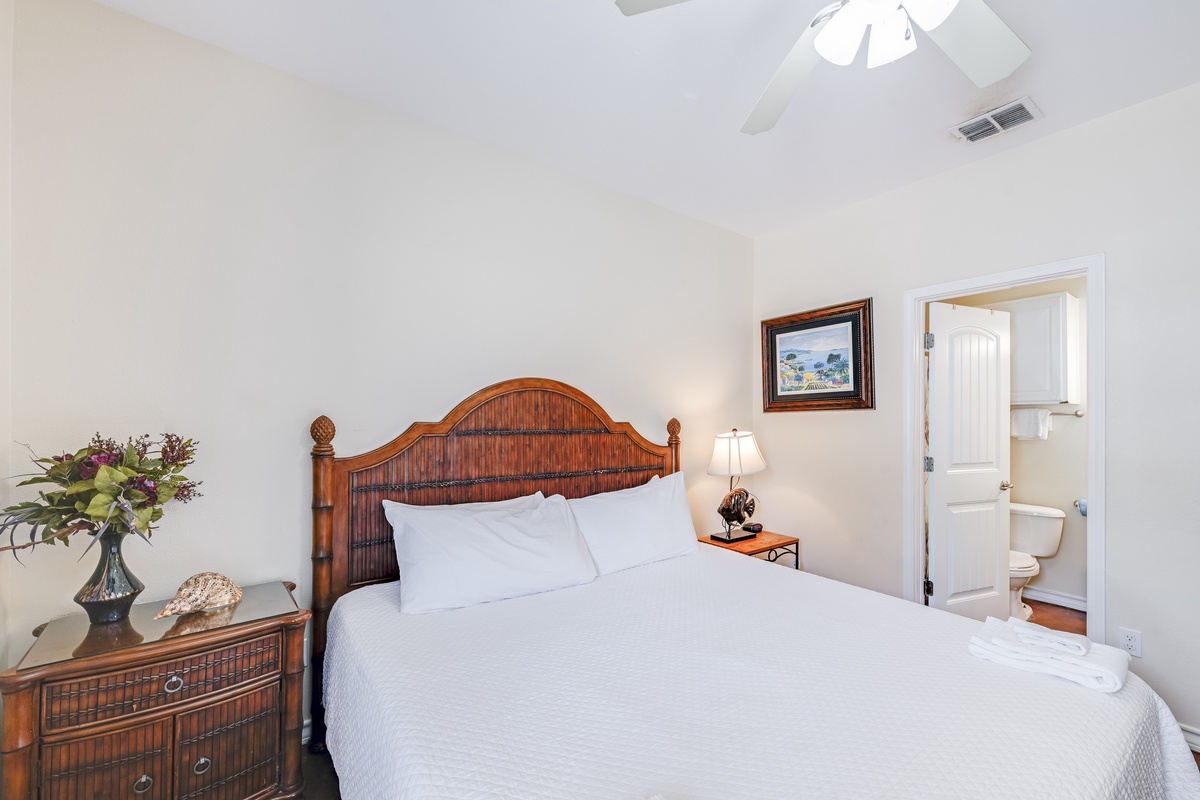 Rest peacefully in your comfortable bedroom with tropical bamboo furnishings and an ensuite bathroom for complete convenience.