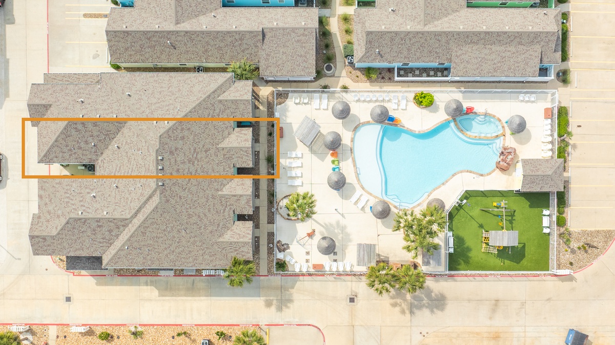 Aerial view of the resort showing pool area and recreational facilities in the surrounding community.