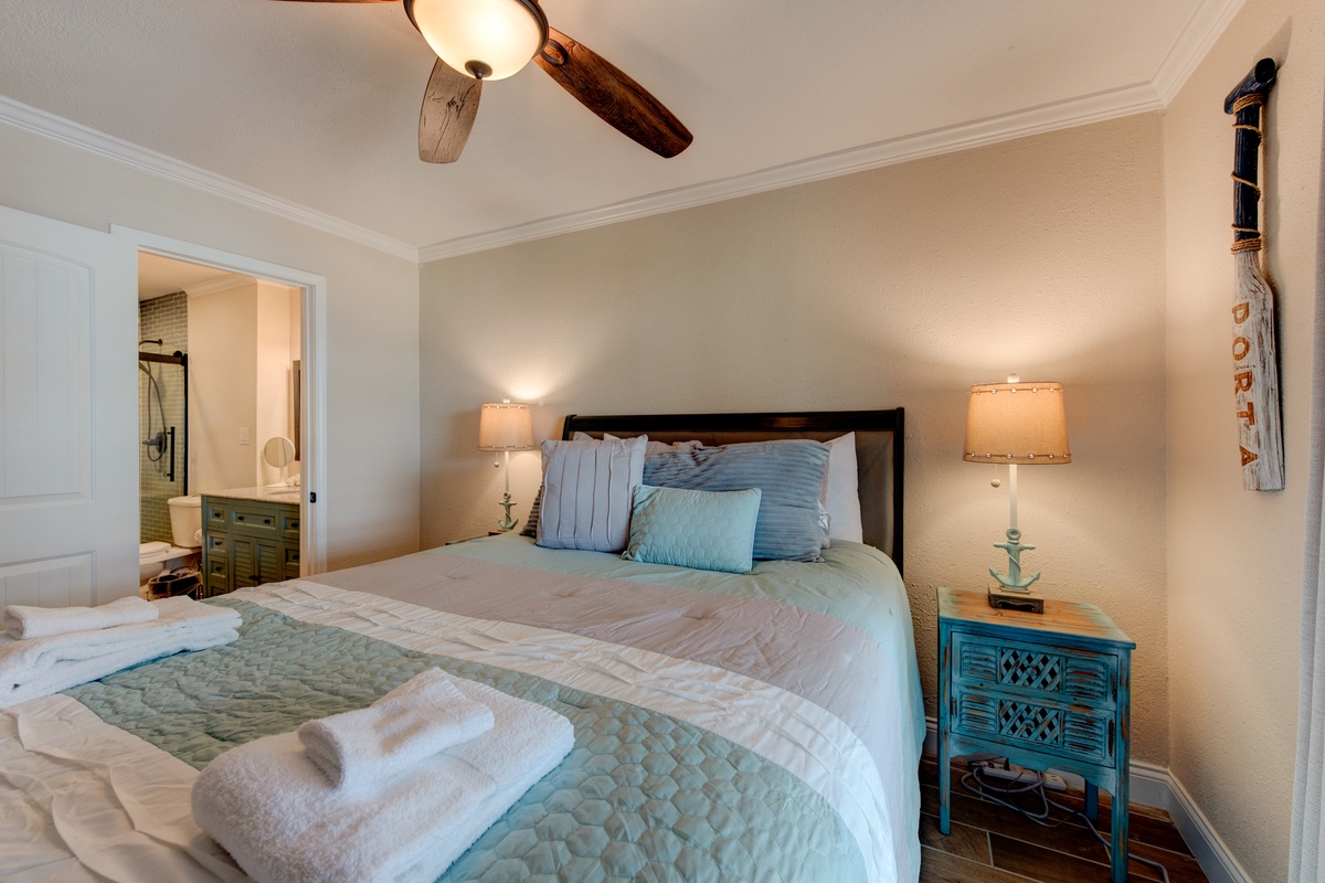 Drift off in your serene bedroom with coastal-inspired decor and soft lighting that creates the perfect ambiance for rest.