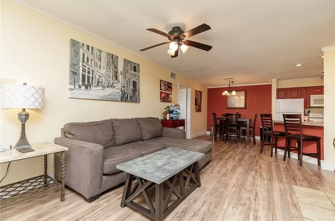 Relax in your spacious open-plan living space featuring comfortable seating, modern decor, and thoughtful touches that make it feel like home.