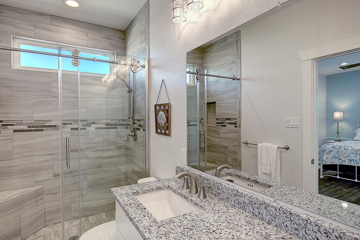Step into your luxurious ensuite with granite counters, spacious glass shower, and elegant finishes that make getting ready feel indulgent.