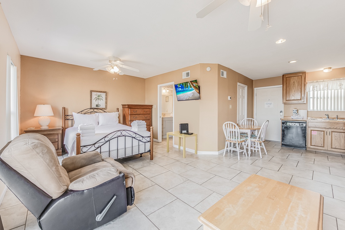 Your spacious studio offers everything you need: a comfortable bed, cozy seating, dining nook, and full kitchen for a perfect getaway.
