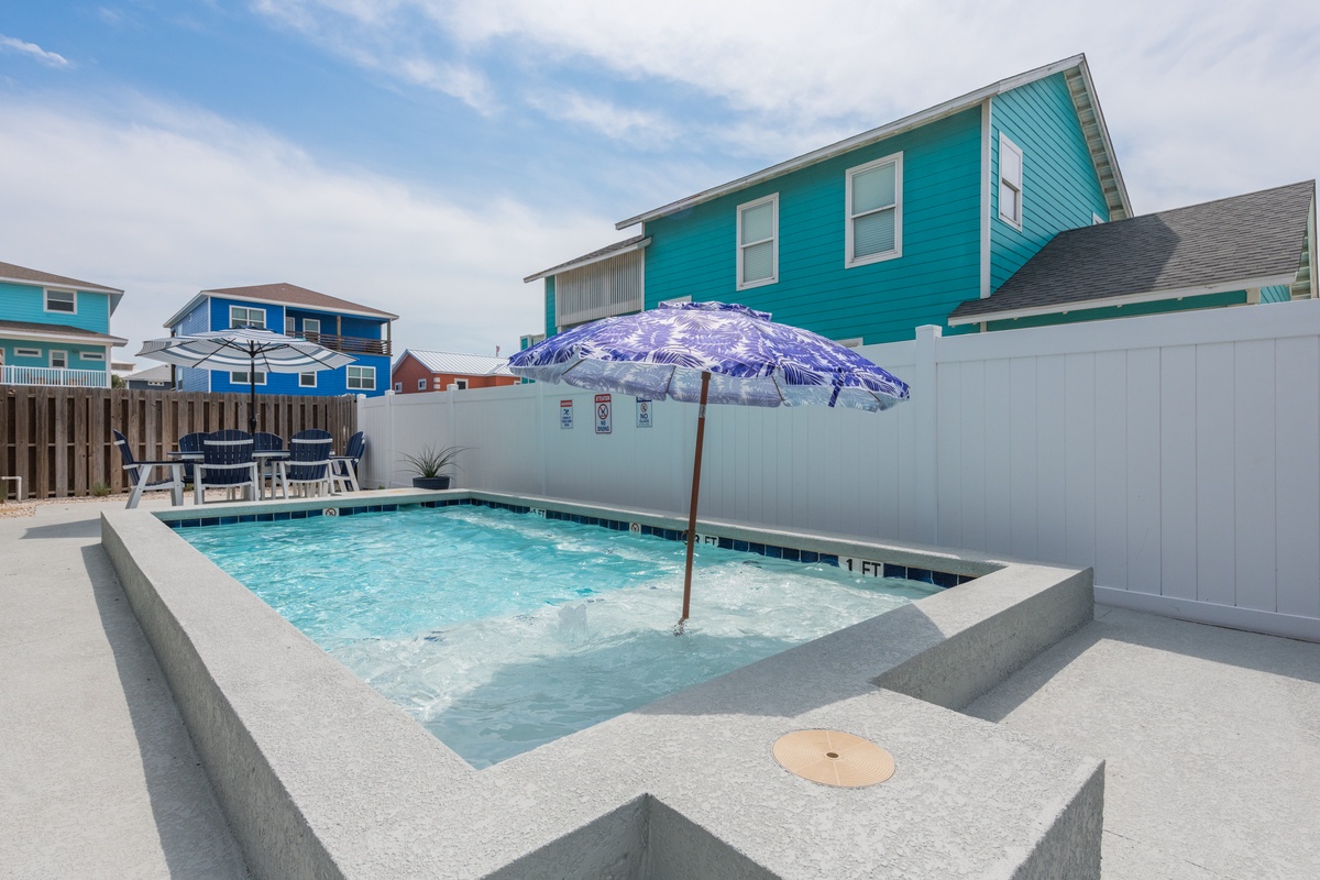 Dive into your private backyard oasis with a sparkling pool perfect for sunny afternoon swims and poolside relaxation.