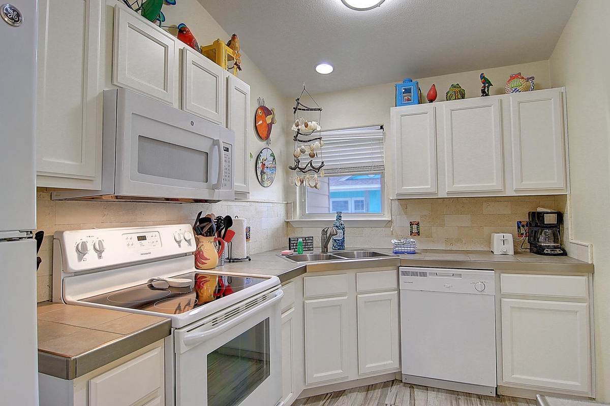 Your fully equipped kitchen awaits with everything needed to prepare meals, from morning coffee to home-cooked dinners during your stay.