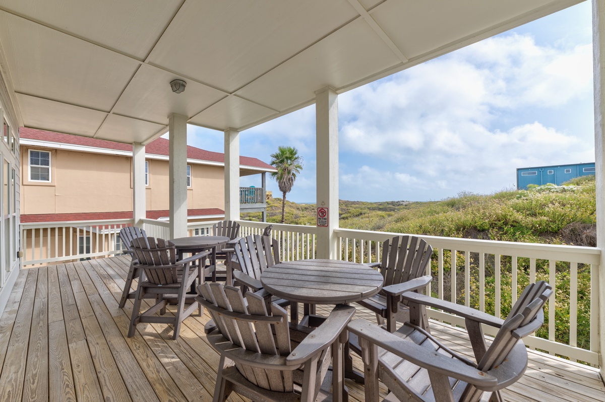 Relax on your private covered deck with comfortable seating, overlooking natural landscape and tropical surroundings.