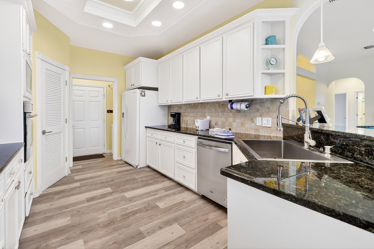 Your fully equipped kitchen features granite countertops, stainless appliances, and everything you need to create memorable vacation meals together.