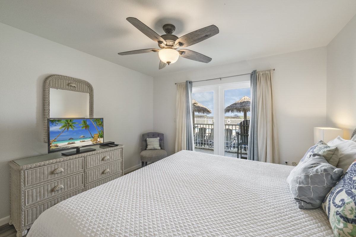 Drift off in comfort with a ceiling fan overhead and tropical views through your private balcony doors. Wake up to soft natural light and coastal breezes.