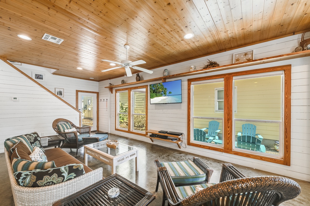 Relax in your stylish island-inspired living space with vaulted wood ceilings and tropical décor.