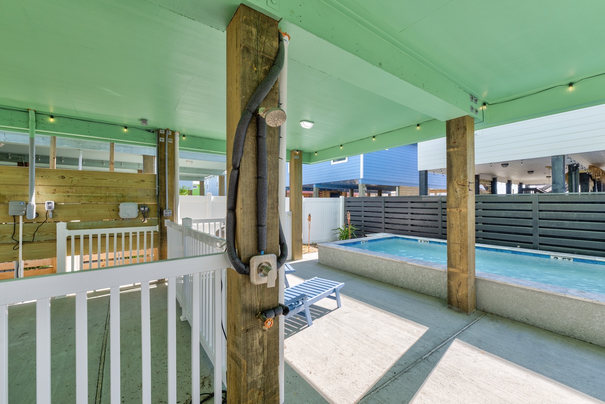 Your private pool oasis awaits under a covered pavilion, complete with a refreshing outdoor shower to rinse off after swimming.