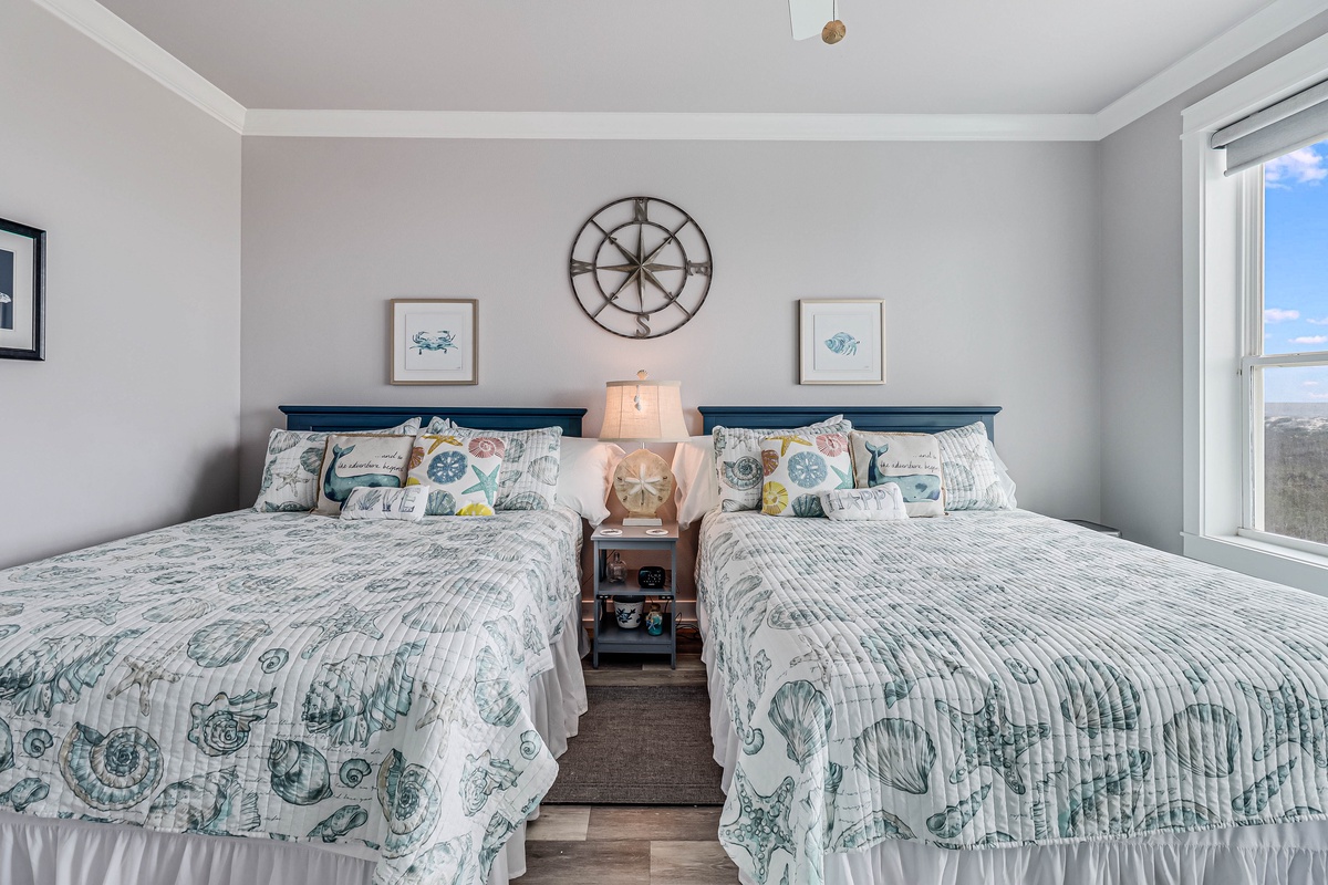 Drift off to sleep in your coastal-themed bedroom where twin beds with nautical linens and ocean views create the perfect seaside retreat.