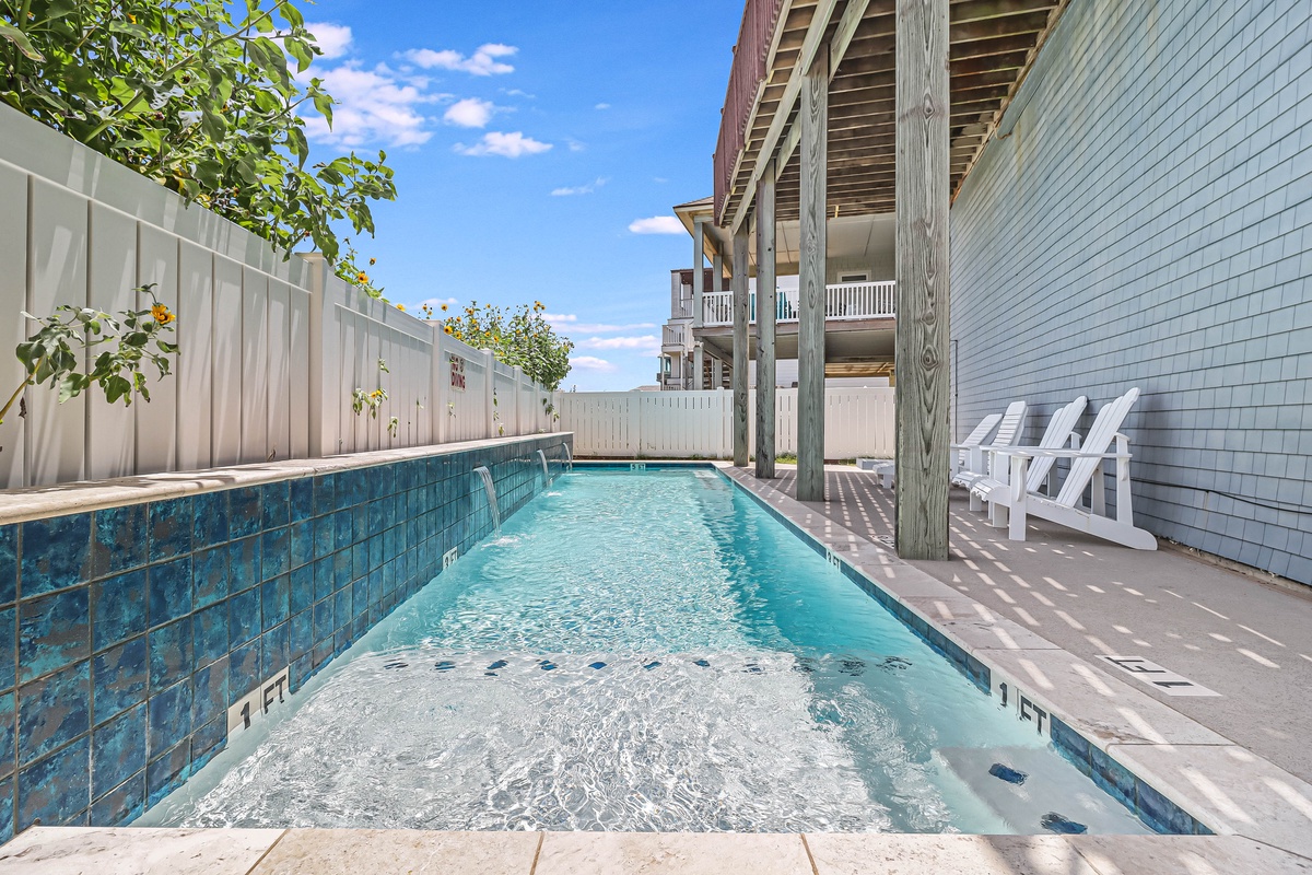Dive into your private pool paradise with sparkling turquoise waters and comfortable poolside loungers for ultimate relaxation.