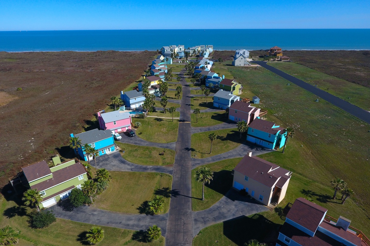 Colorful coastal community sits just steps from the ocean, offering a peaceful beachside retreat surrounded by natural landscape.