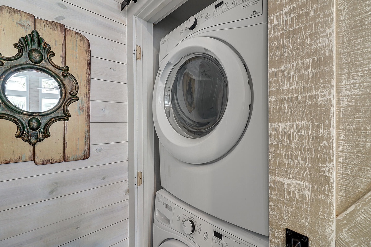 Your in-unit washer and dryer make extended stays effortless, tucked neatly in a charming closet adorned with vintage-style decor.