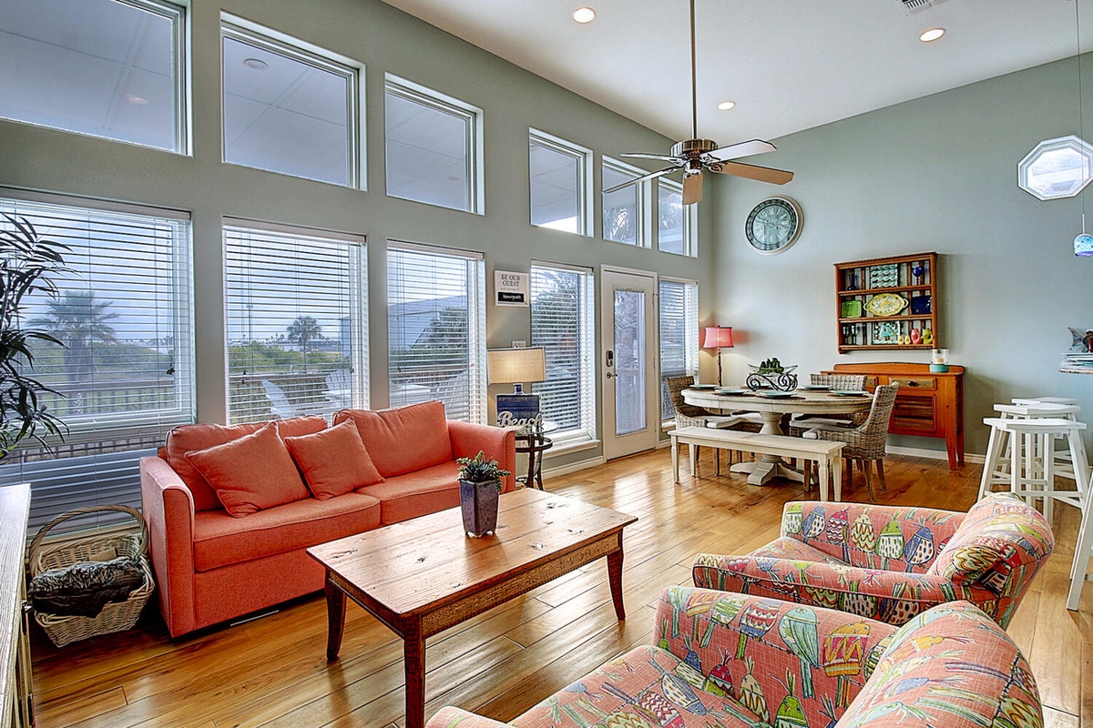 Sink into plush seating surrounded by soaring windows that fill your space with natural light and peaceful views.