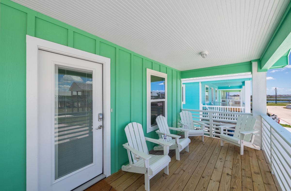 Relax on your private covered deck with coastal Adirondack chairs, perfect for morning coffee or evening wind-down.