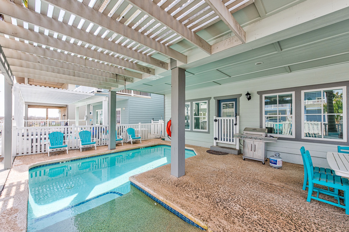 Dive into your private pool paradise with turquoise waters, outdoor kitchen, and coastal charm creating the perfect backyard escape.