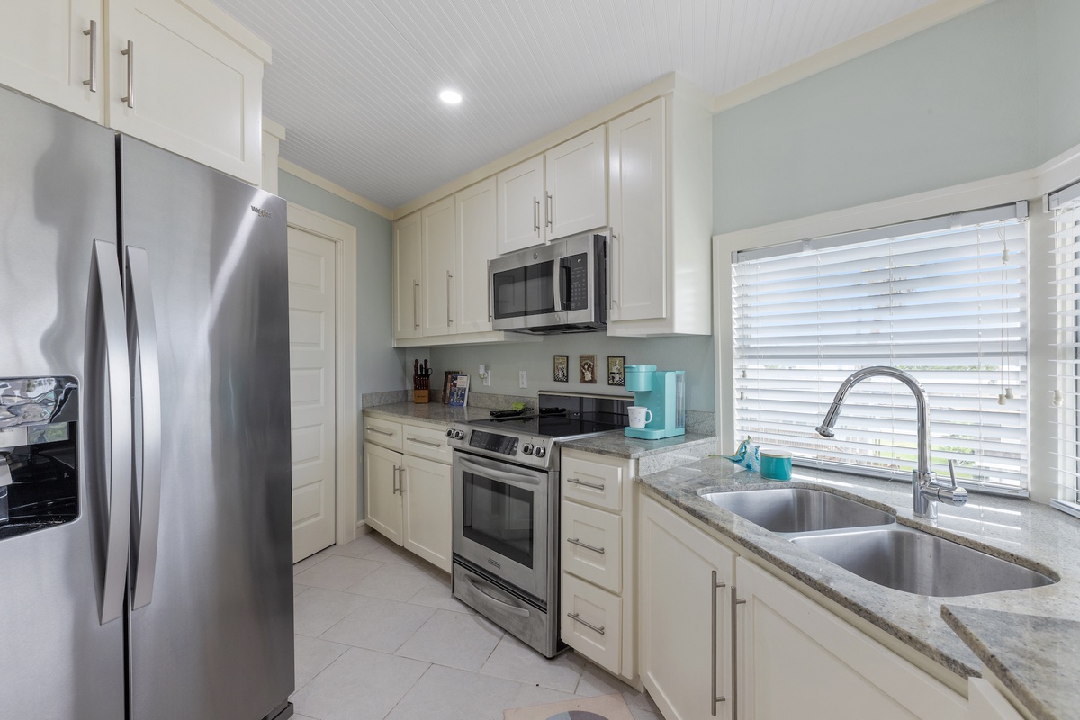 Your fully equipped kitchen features stainless steel appliances, granite counters, and everything needed for memorable meals.