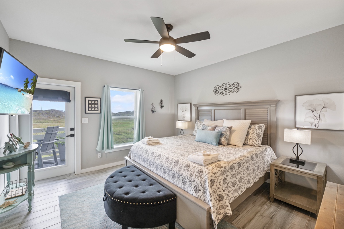 Drift off in this elegant bedroom where soft linens and gentle breezes from your private balcony create the perfect retreat.