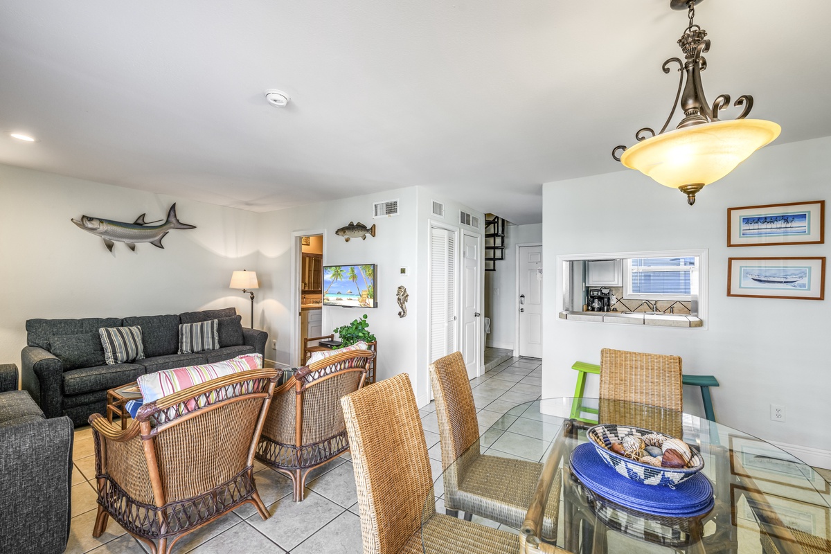 Relax in your coastal-themed living space with wicker furniture, nautical touches, and an open layout perfect for vacation gatherings.