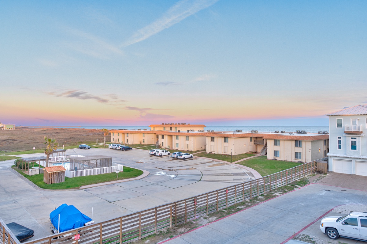 Coastal property complex offering peaceful beachside accommodations with stunning ocean views and convenient parking.