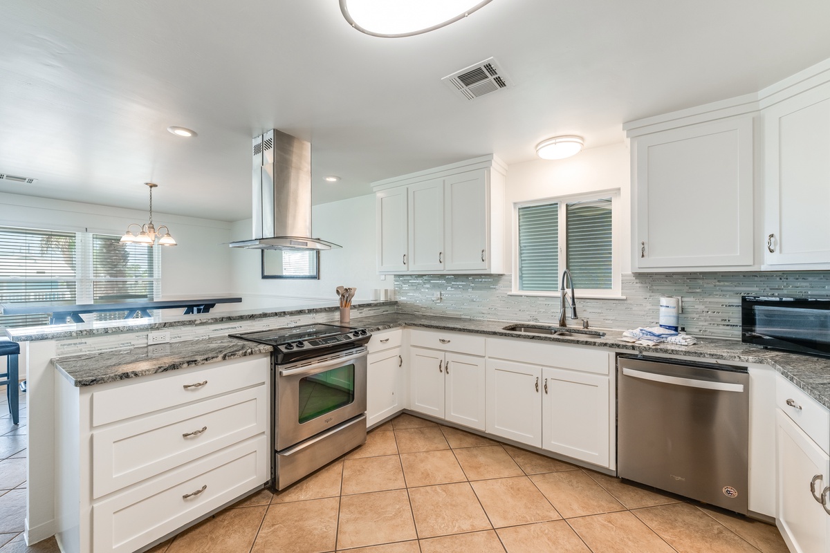 Your spacious gourmet kitchen awaits with granite countertops, stainless steel appliances, and everything needed for memorable meals during your stay.