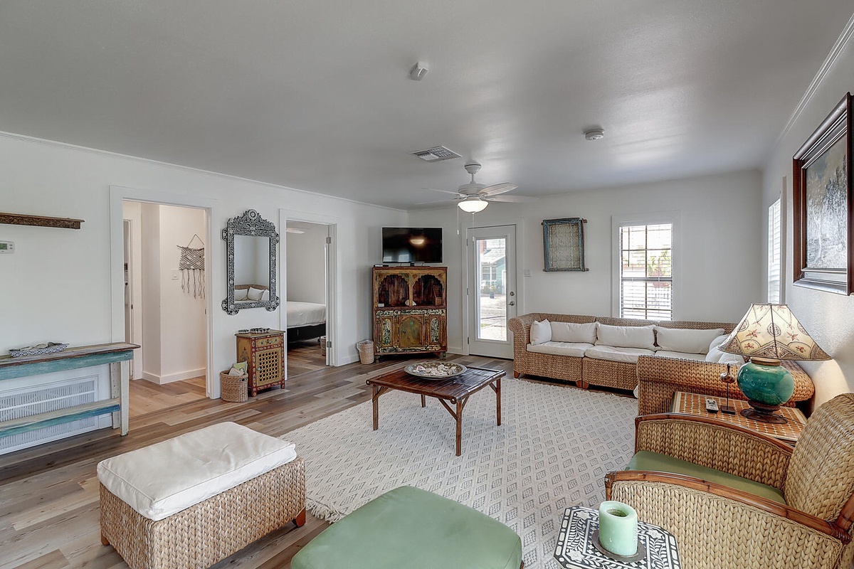 Unwind in your spacious living room with wicker furnishings, perfect for movie nights and morning coffee in natural light.