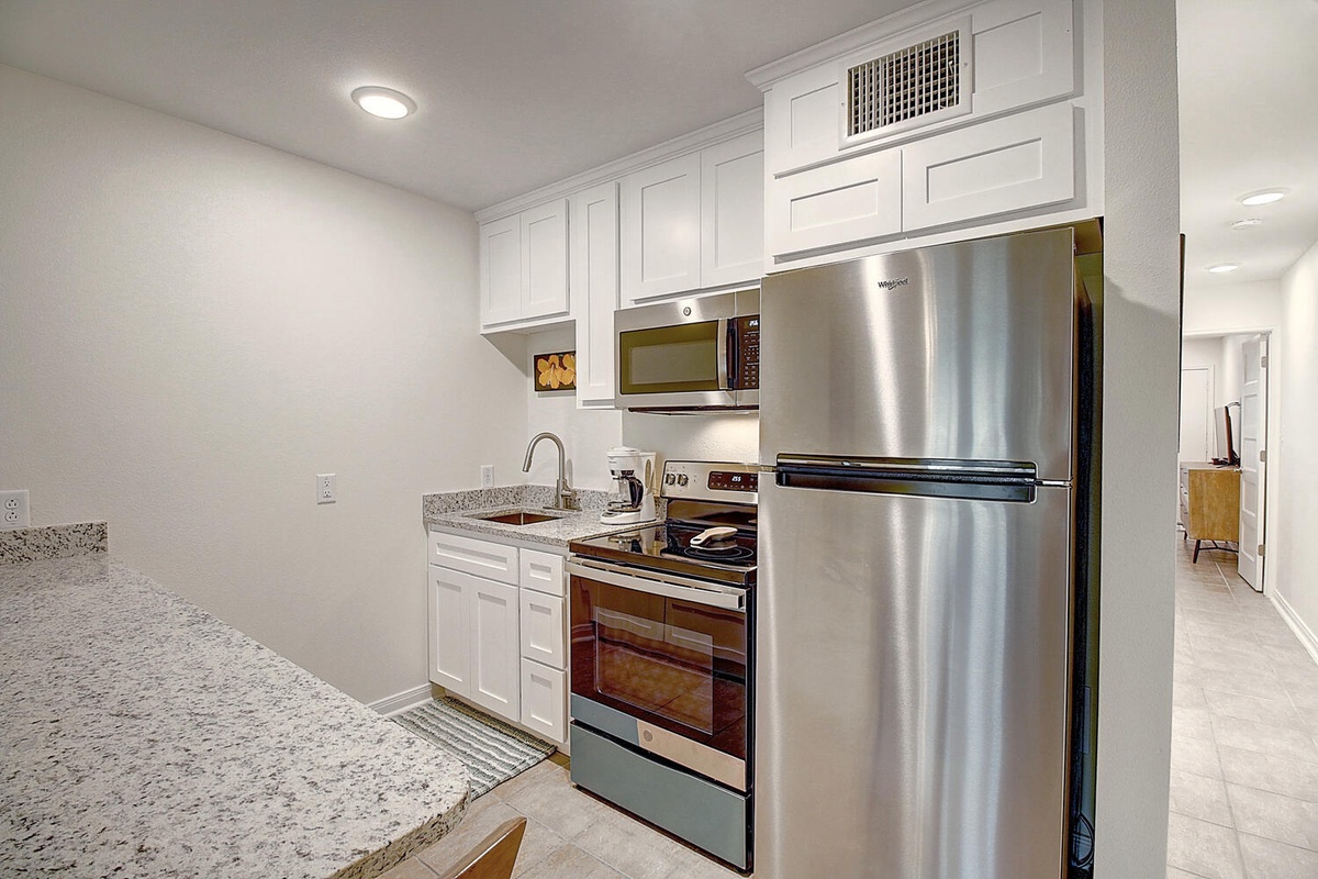 Your fully equipped kitchen features stainless steel appliances and granite countertops, perfect for preparing memorable meals during your stay.