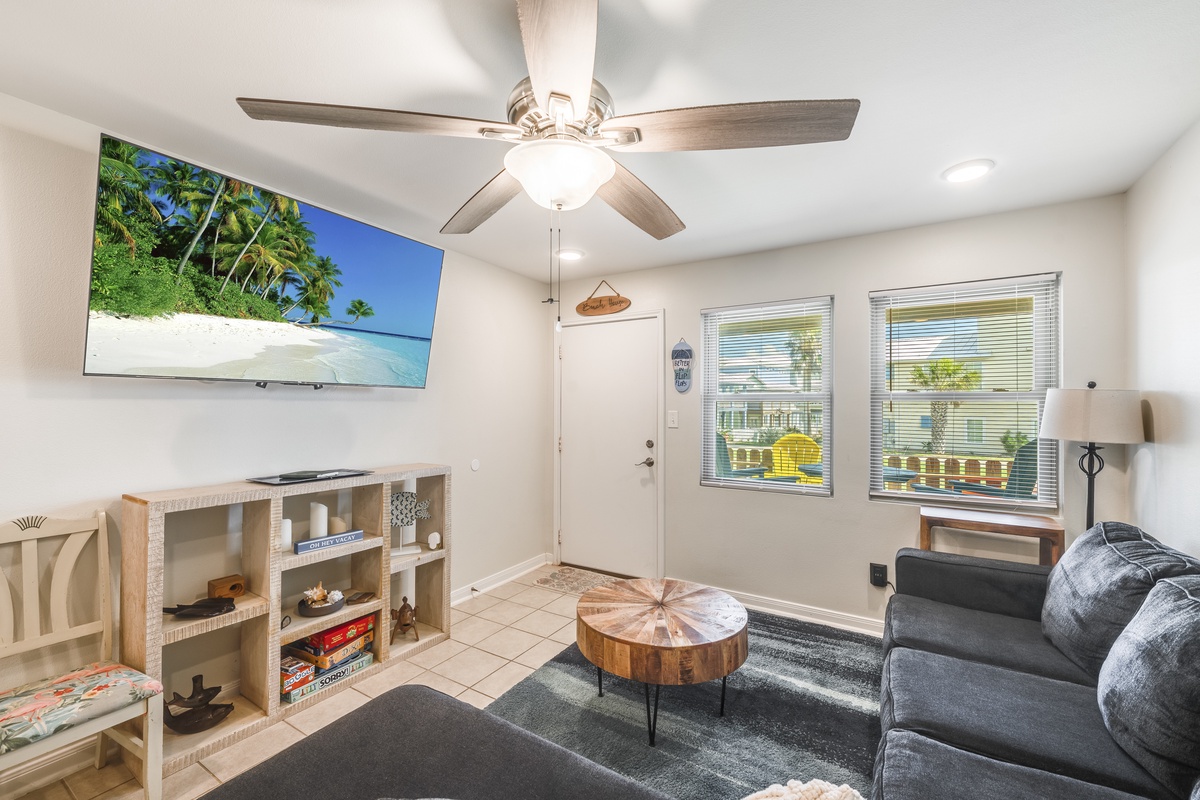 Unwind in your bright living room with tropical beach views on the large TV and comfortable seating.