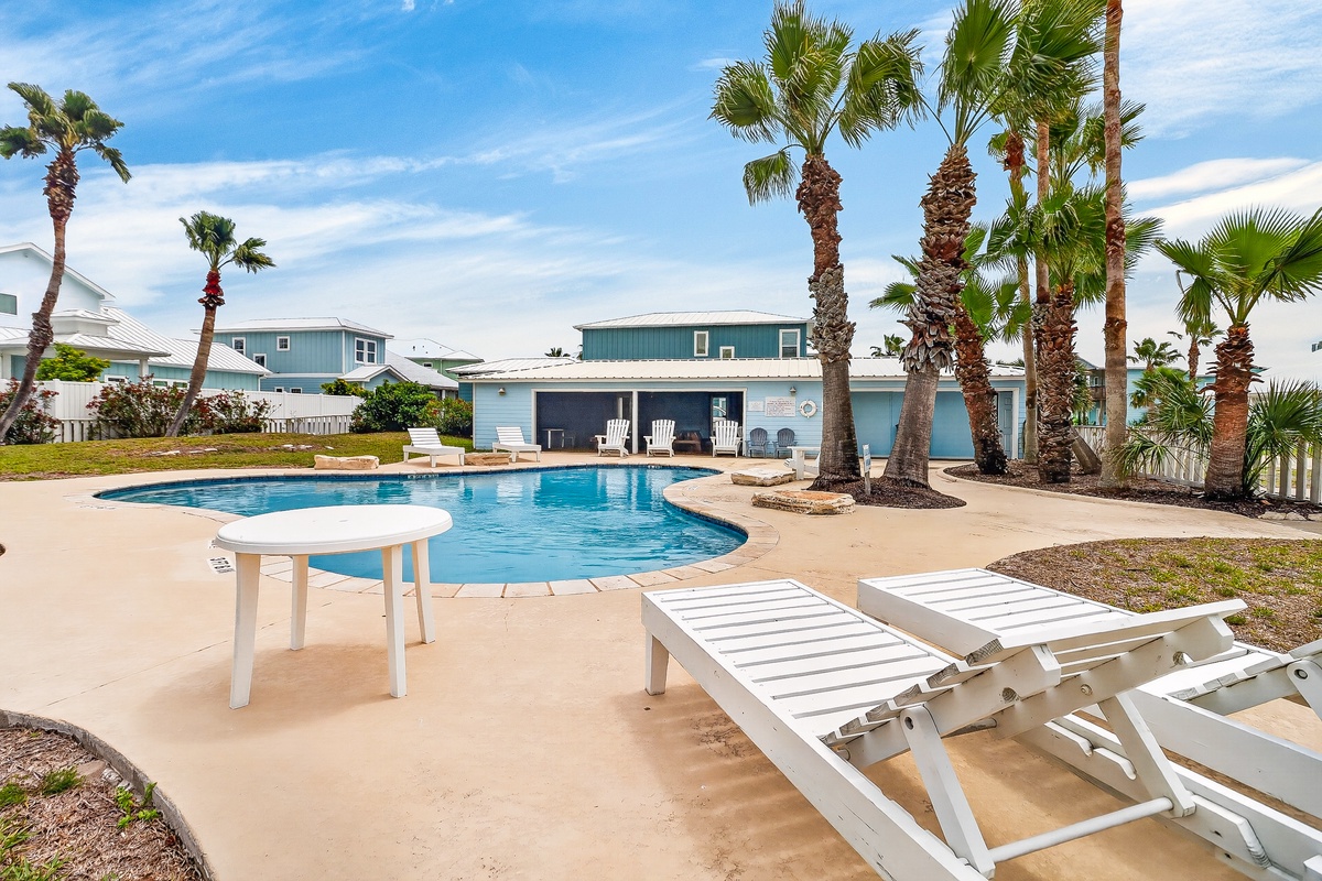 Relax by your private pool surrounded by swaying palms and tropical charm in this coastal paradise retreat.