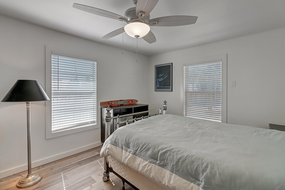 Drift into peaceful sleep in your comfortable bedroom, where natural light filters through and a ceiling fan keeps you cool all night.
