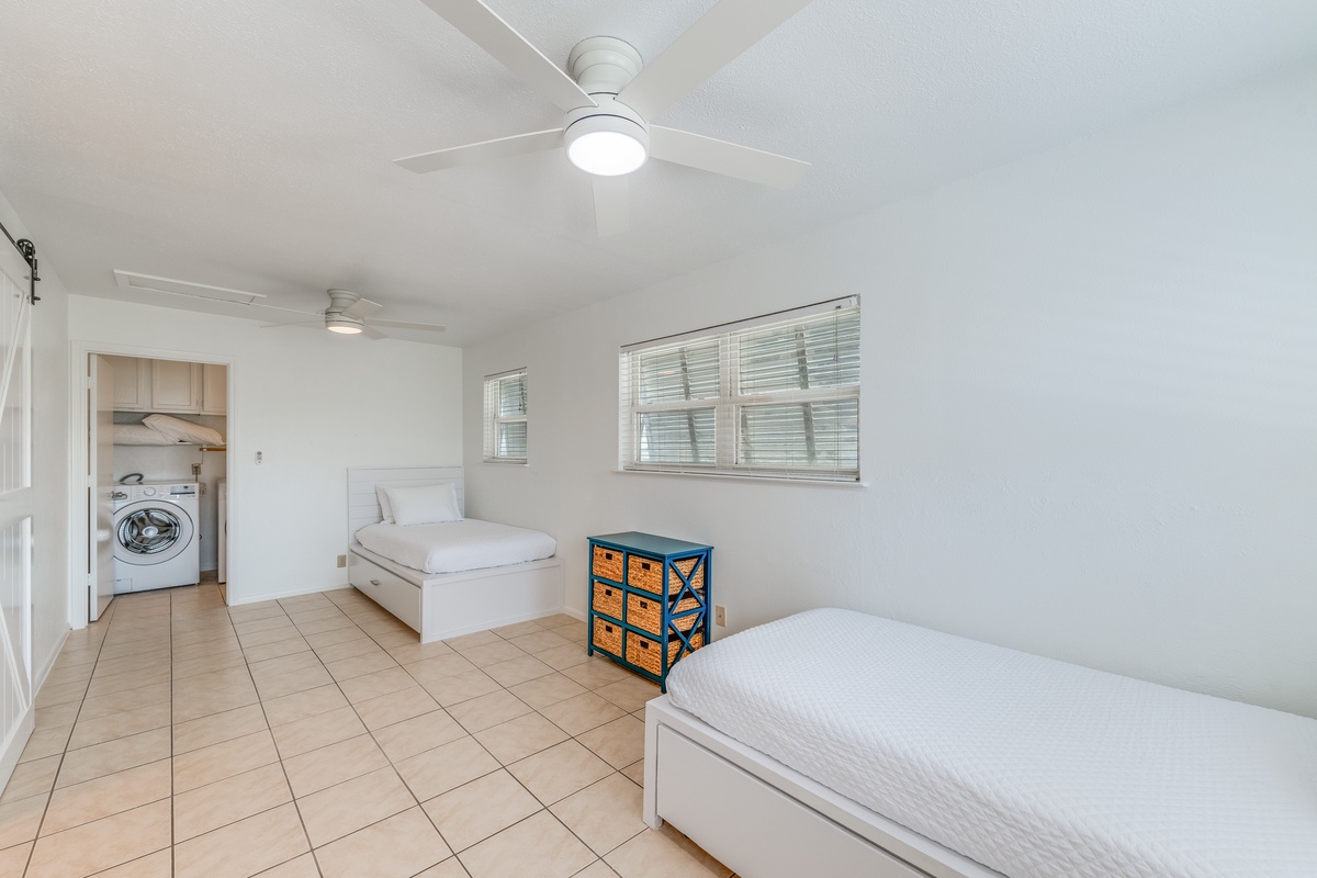 Your bright, airy room features twin beds with fresh linens and ceiling fans to keep you cool and comfortable.
