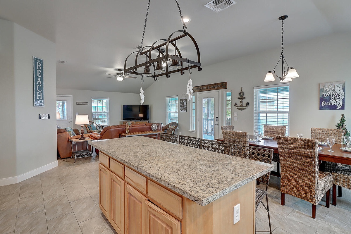 Your spacious kitchen island flows seamlessly into the living and dining areas, perfect for gathering with loved ones over home-cooked meals.