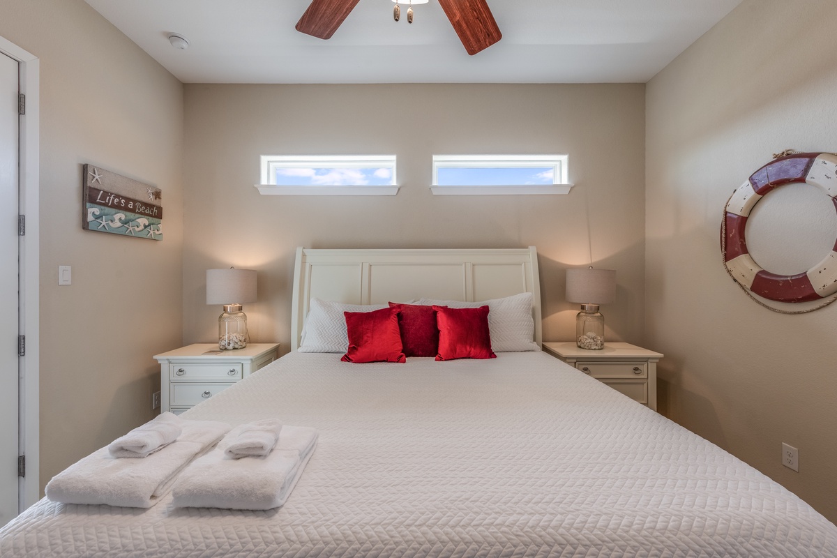 Relax in your coastal-themed bedroom with soft linens, warm lighting, and charming nautical touches that create the perfect seaside retreat.