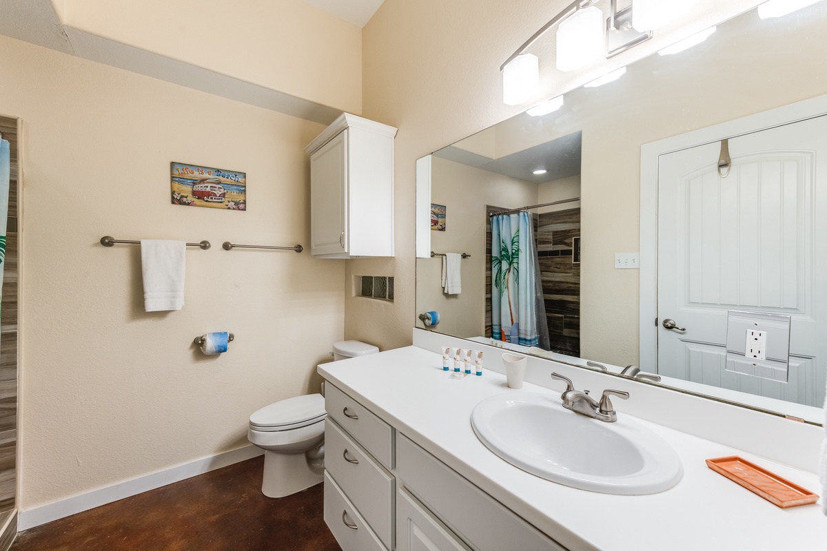 Refresh in your private bathroom featuring modern amenities, ample counter space, and thoughtful touches for your comfort.