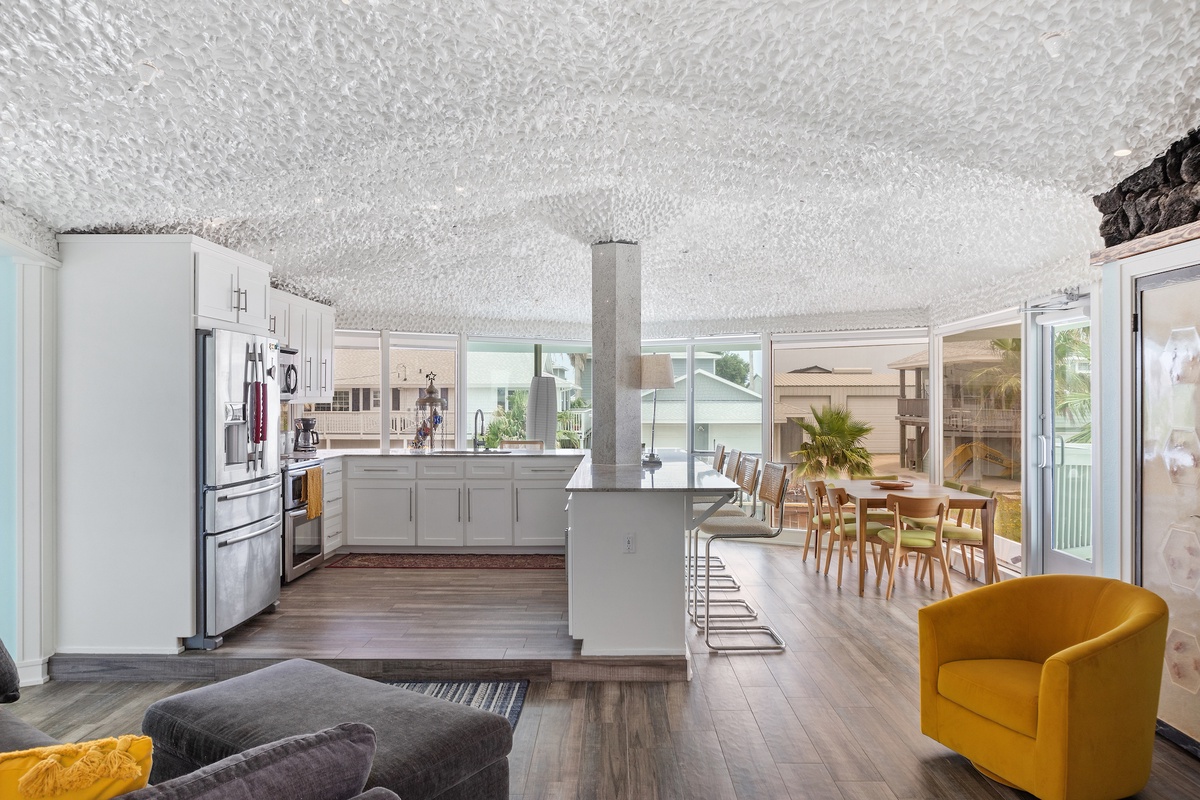 Gather in this stunning open-plan space where your modern kitchen flows into a warm dining area, perfect for memorable meals together.
